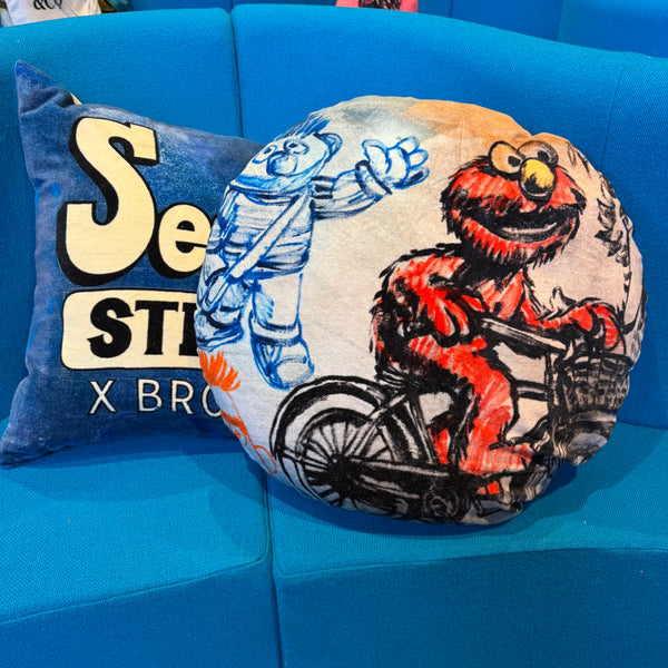 'ELMO ON BIKE' VELVET ROUND CUSHION BY DAVID BROMLEY. 50CM