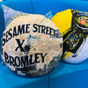'SUPER GROVER' VELVET ROUND CUSHION BY DAVID BROMLEY. 50CM