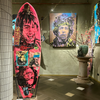 12. Customised surfboard by David Bromley. Hand painted in oils and acrylic with printed metal transfers and mixed media coatings